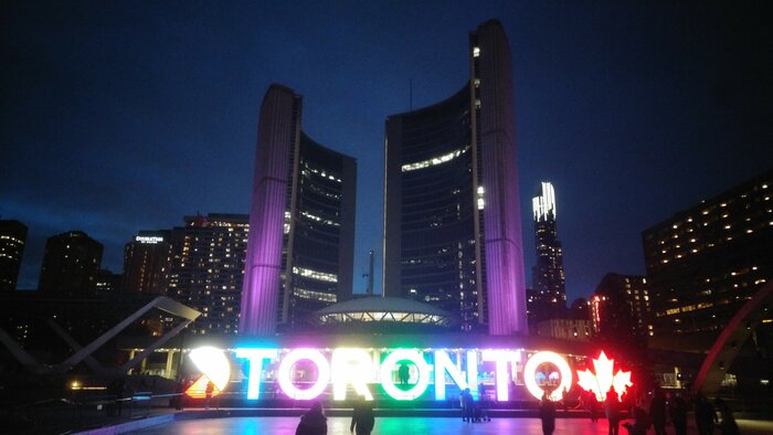 TORONTO city sign with buildings